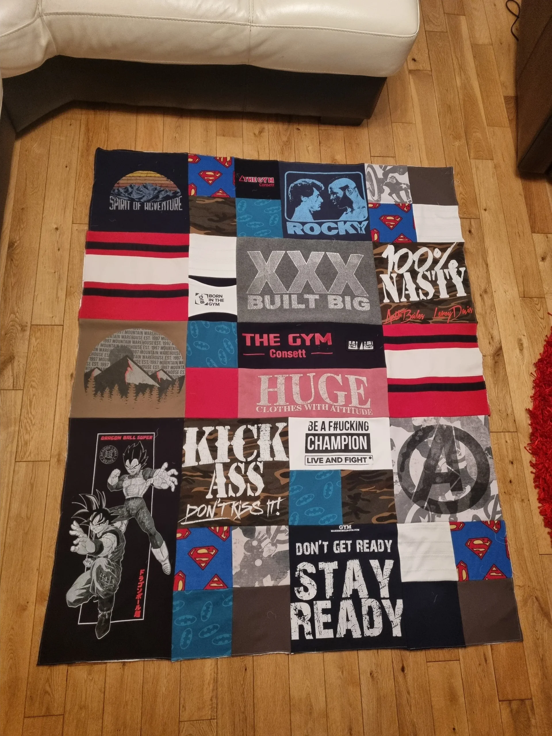 patchwork memory blanket displayed flat and made from printed T-shirts