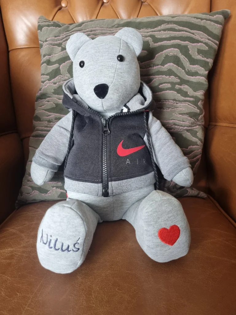 light grey memory bear wearing a personalised black waistcoat