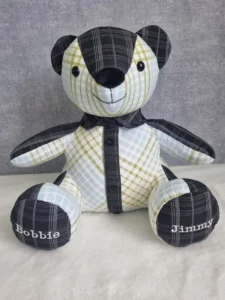 front view of a checked memory bear with embroidered paws