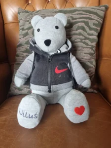 light grey memory bear wearing a personalised black waistcoat