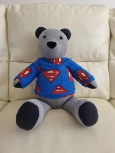 memory bear wearing a handmade superhero fabric jumper