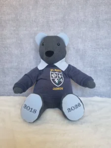 grey memory bear made from a school uniform jumper