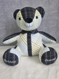 front view of a checked memory bear with embroidered paws