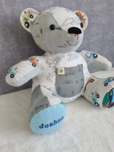 seated memory bear handmade from pale blue printed children's clothing