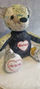 handmade memory bear created from green and navy clothing